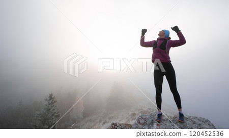 woman man standing on top of a mountain as the sun sets. Goals and achievements concept photo composite 120452536
