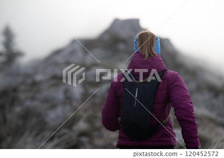 trail running woman athlete training for ultra-marathon race in a mountain 120452572
