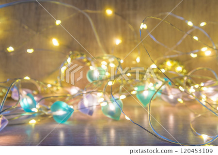 Christmas lights on wooden background 120453109