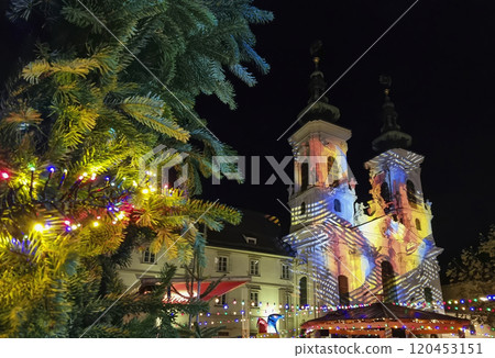Beautiful Christmas decorations and Mariahilfer church , at night, in the city center of Graz, Styria region, Austria 120453151