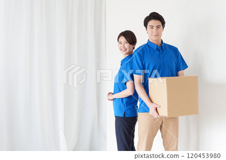 Delivery men and women carrying cardboard boxes 120453980