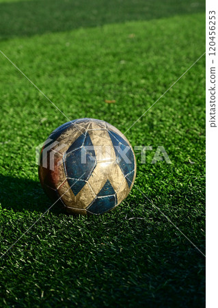 artificial green grass soccer field with blue training ball artificial green grass soccer field with blue training ball 120456253