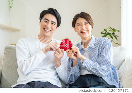 Man and woman laughing with wallets Man and woman laughing with wallets 120457571