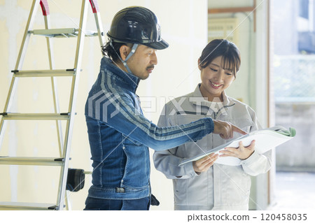Young woman working at a construction site Young woman working at a construction site 120458035