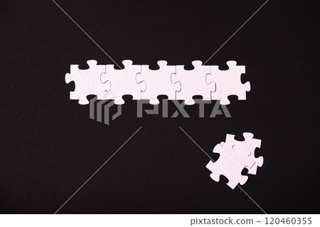 A puzzle piece is missing from a puzzle A puzzle piece is missing from a puzzle 120460355