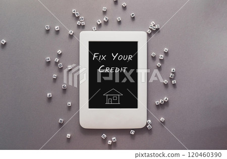 A white tablet with the words Fix Your Credit written on it A white tablet with the words Fix Your Credit written on it 120460390
