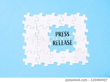 A puzzle with the word press release written in the middle 120460407