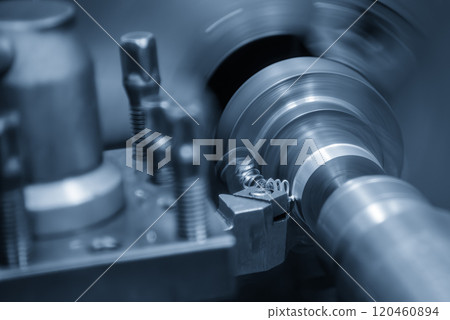 The turning machine operation with continue chip from turning process. The turning machine operation with continue chip from turning process. 120460894