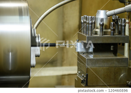 The lathe machine drilling process the metal parts. The lathe machine drilling process the metal parts. 120460896