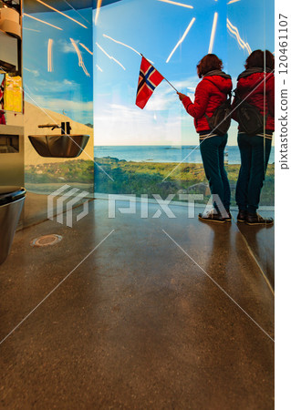 Tourist with norwegian flag in mirrored toilet, Andoy Norway Tourist with norwegian flag in mirrored toilet, Andoy Norway 120461107