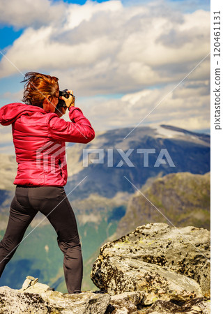Tourist taking photo from Dalsnibba mountain, Norway Tourist taking photo from Dalsnibba mountain, Norway 120461131