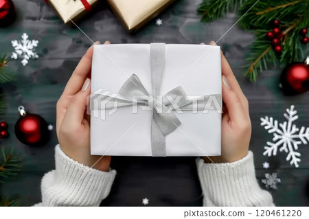 Elegant Christmas Gift Box Mockup with Silver Ribbon Held in Hands 120461220