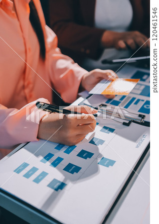 Young Asian business creative team work together, mobile application software design project. Brainstorm meeting, internet technology, smartphone web app designer, office coworker teamwork concept 120461546