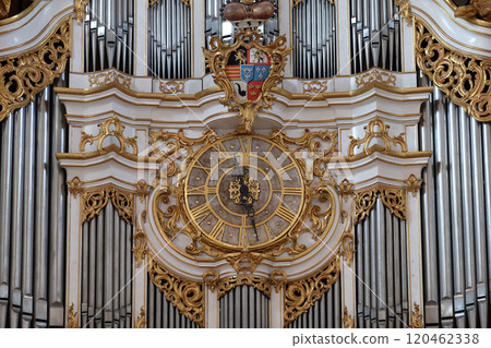 Clock on the organ in Amorbach Benedictine monastery church in the district of Miltenberg in Lower Franconia in Bavaria, Germany Clock on the organ in Amorbach Benedictine monastery church in the district of Miltenberg in Lower Franconia in Bavaria, Germany 120462338
