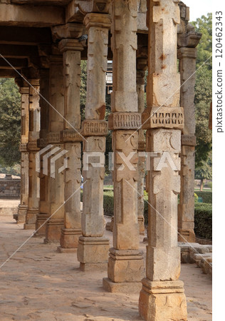 Columns with stone carving in courtyard of Quwwat-Ul-Islam mosque, Qutub Minar complex, Delhi, India Columns with stone carving in courtyard of Quwwat-Ul-Islam mosque, Qutub Minar complex, Delhi, India 120462343