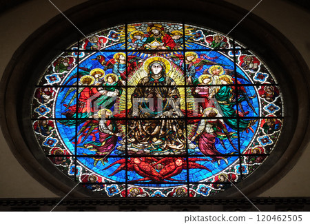 Virgin Mary surrounded by Angels by Lorenzo Ghiberti, 1405, stained glass window in the Cattedrale di Santa Maria del Fiore (Cathedral of Saint Mary of the Flower), Florence, Italy 120462505