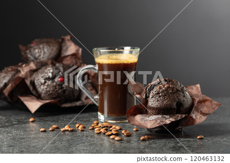 Dark chocolate muffins and cup of black coffee. Dark chocolate muffins and cup of black coffee. 120463132