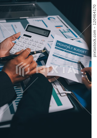 Fund managers team consultation and discuss about analysis Investment stock market at office 120464170