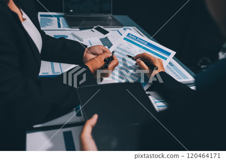 Fund managers team consultation and discuss about analysis Investment stock market at office 120464171
