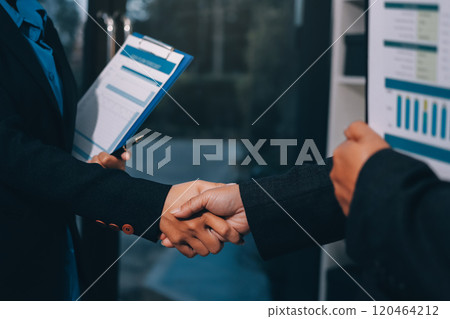 Female hands shaking at group meeting making partnership deal, businesswoman welcoming new partner with handshake as concept of collaboration gratitude respect, women power in business, close up view 120464212