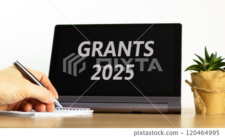 Planning grants 2025 new year symbol. Concept words Grants 2025 on beautiful black tablet. Beautiful white background. Businessman hand. Business grants 2025 new year concept. Copy space. Planning grants 2025 new year symbol. Concept words Grants 2025 on beautiful black tablet. Beautiful white background. Businessman hand. Business grants 2025 new year concept. Copy space. 120464995