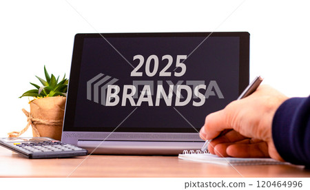 Planning 2025 brands new year symbol. Concept words 2025 Brands on beautiful black tablet. Beautiful white background. Businessman hand. Business 2025 brands new year concept. Copy space. Planning 2025 brands new year symbol. Concept words 2025 Brands on beautiful black tablet. Beautiful white background. Businessman hand. Business 2025 brands new year concept. Copy space. 120464996