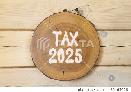 Planning tax 2025 new year symbol. Concept words Tax 2025 on beautiful wooden circle. Beautiful wooden wall background. Business tax 2025 new year concept. Copy space. 120465008