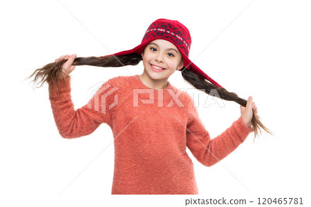 Teen child portrait wearing warm winter hat. Girl kid isolated on white. Happy childhood. Teen girl wearing knitted sweater. Winter fashion style. Stylish girl in winter hat. Cozy winter wear 120465781