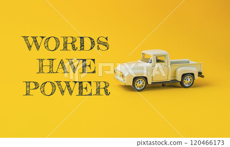 Toy truck is on a yellow background with the words Words have power 120466173