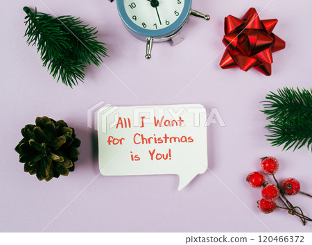The sign is surrounded by various Christmas decorations, including a clock The sign is surrounded by various Christmas decorations, including a clock 120466372