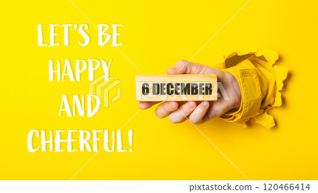 Person holding a block of wood with the words Let's be happy Person holding a block of wood with the words Let's be happy 120466414
