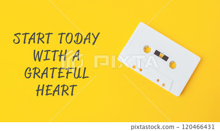 White cassette tape with a yellow background White cassette tape with a yellow background 120466431