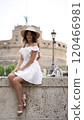 Stylish Tourist Enjoying Peaceful Moment by Castel Sant Angelo in Rome  120466981