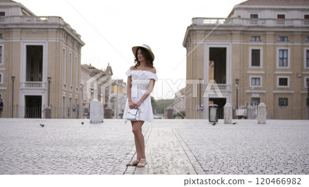 Elegant Tourist by Iconic Fountain in Vatican City St. Peters Square  120466982