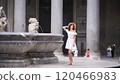 Elegant Woman Posing by Historic Fountain at the Pantheon, Rome, Italy  120466983