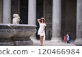 Fashionable Tourist by the Ancient Pantheon Fountain, Capturing Roman Elegance 120466984