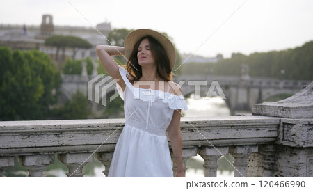 Elegant Woman Overlooking the Tiber River and Historic Roman Architecture Elegant Woman Overlooking the Tiber River and Historic Roman Architecture 120466990