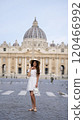 Graceful Woman in White Outfit Admiring St. Peter Square, Vatican City  120466992