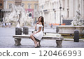 Tourist in White Dress Relaxing Near Piazza Navona Famous Baroque Fountains  120466993