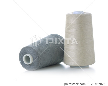 Close-Up of Two Thread Spools in White and Gray Close-Up of Two Thread Spools in White and Gray 120467076