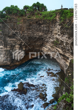 Cinematic aerial landscape shots of the beautiful island of Nusa Penida. Huge cliffs by the shoreline and hidden dream beaches with clear water and foaming wave. Cinematic aerial landscape shots of the beautiful island of Nusa Penida. Huge cliffs by the shoreline and hidden dream beaches with clear water and foaming wave. 120467383