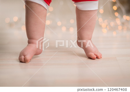 Cute little tender baby feet. Close-up 120467408