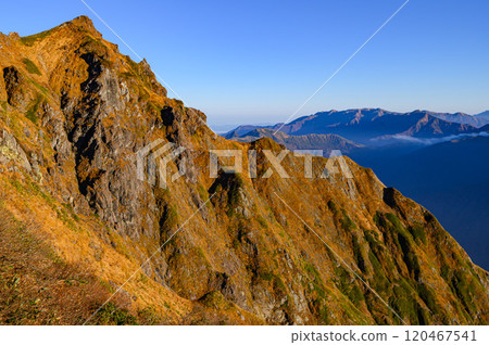 A spectacular view of the summit and Machigazawa valley from the Nishikuro Ridge in autumn at Mt. Tanigawa 120467541