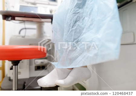 A young woman at a mammologist's appointment for examination of mammary glands and lymph nodes. Patient waiting of gynecological ultrasound exam. 120468437