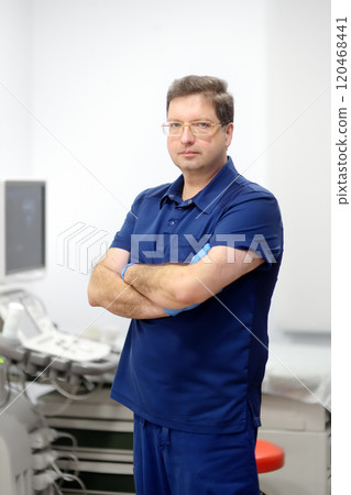Portrait of oncologist mammologist doctor during appointment of patient. Doctor of ultrasound scanning during working in modern clinic. 120468441