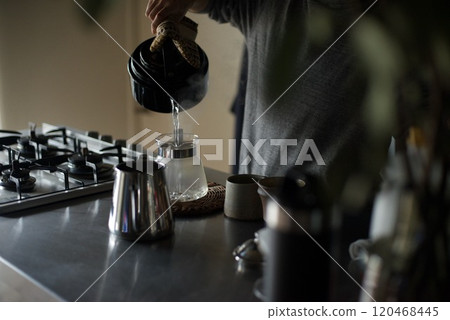 Heating the equipment with hot water to make coffee 120468445