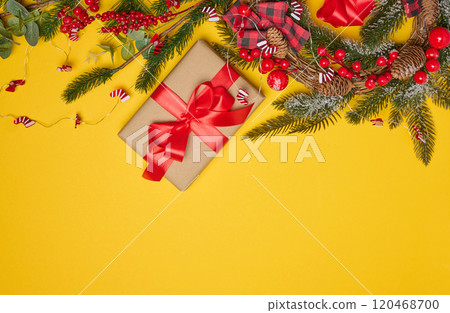 Christmas background, wrapped gift in brown paper and red silk ribbon, top view Christmas background, wrapped gift in brown paper and red silk ribbon, top view 120468700