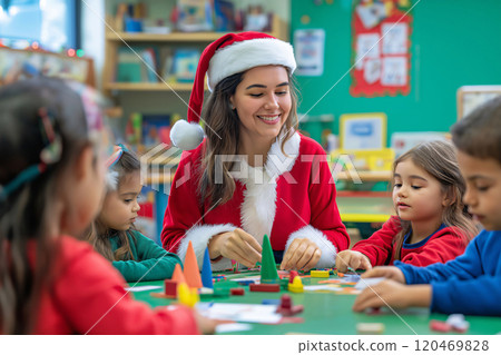 Teacher wearing a santa claus costume is smiling while making christmas decorations with a group of children in a classroom 120469828