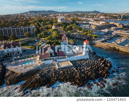 Aerial view of Santa Marta lighthouse and Cascais marina with Cascais cityscape 120471403