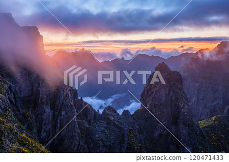 Mountains on sunset covered in fog and clouds. Madeira island, Portugal Mountains on sunset covered in fog and clouds. Madeira island, Portugal 120471433